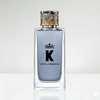 Dolce & Gabbana K perfume bottle with decorative cap on a gradient background